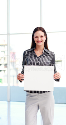 Young woman showing a big business card