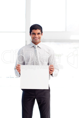 Hispanic businessman holding a white card