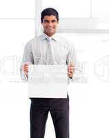 Smiling businessman holding a white card