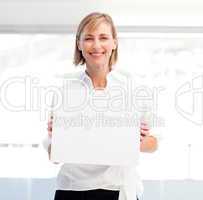 Smiling woman showing a big business card