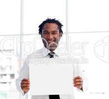 Portrait of an Afro-American businessman holding a white card