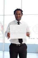 Friendly Afro-American businessman holding a white card