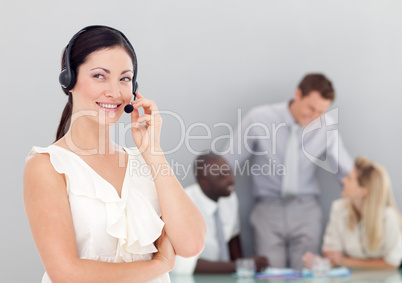 Attractive businesswoman talking on a headset