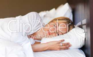 Young woman relaxing in bed