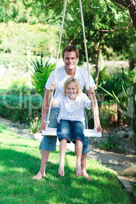 Father and son on a swing