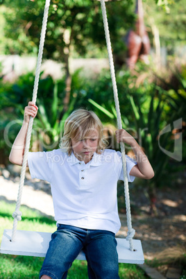 Kid having fun on a swing