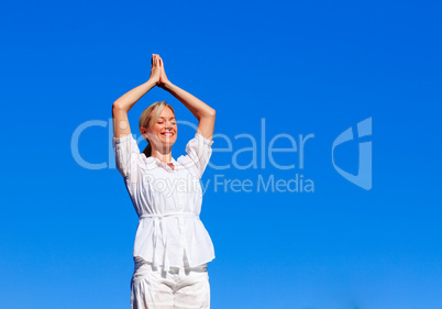 Young girl practicing yoga with copy-space