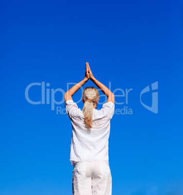 Blond woman practising yoga