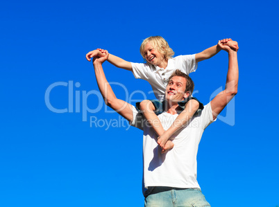 Boy giving kid a piggyback ride