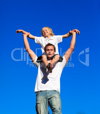 Dad giving his son a piggyback ride