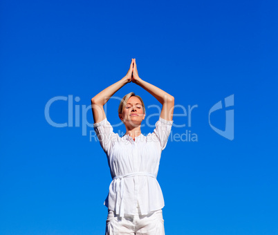 Attractive woman practising meditation