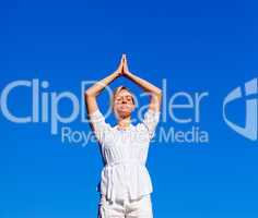 Attractive woman practising meditation