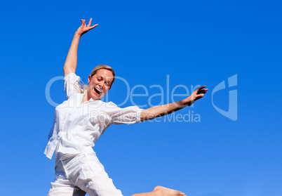 Young girl jumping in a park