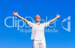 Happy woman feeling free with open arms