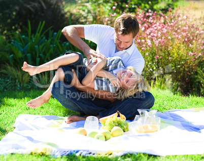 Father and son enjoying a picnic