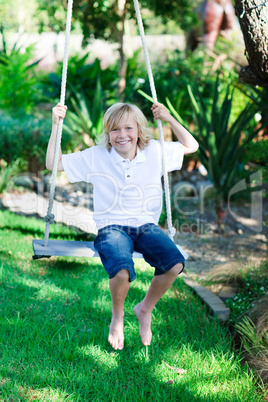 Kid having fun on a swing