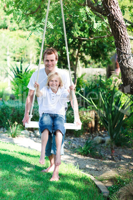 Father and son swinging