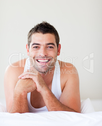 Smiling man in bed