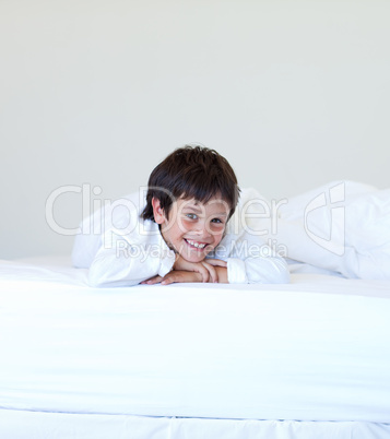 Kid smiling in a bed