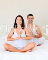 Young couple meditating