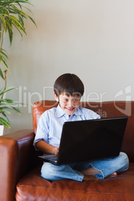 Kid using his laptop