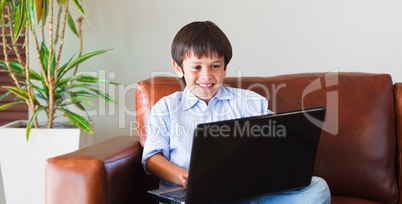 Child playing with his laptop