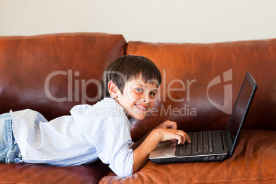 Kid using his laptop