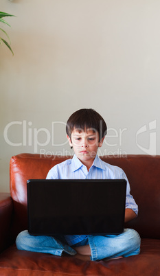 Kid using his laptop