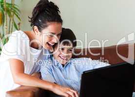 Mother and son having fun with a laptop