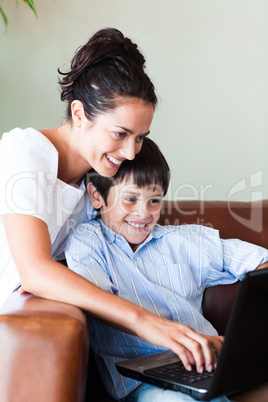 Mother and son playing with a laptop