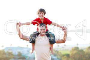 Father giving son piggyback ride