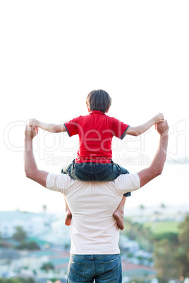 Father giving son piggyback ride