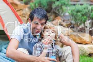 Father and son blowing bubbles