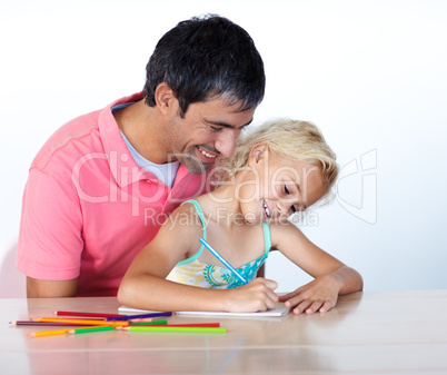 Man and little girl painting together