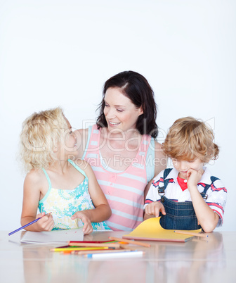 Mother and children drawing together
