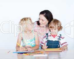 Mother and children doing homework together