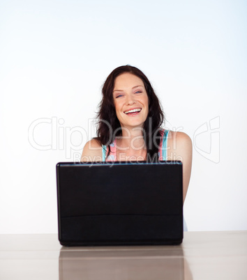 Portrait of a smiling woman with her laptop