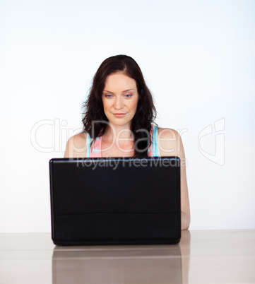 Serious woman focused on her laptop