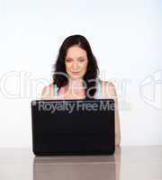 Serious woman focused on her laptop