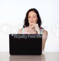 Serious woman working with her laptop