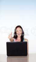 Happy smiling woman using her laptop with copy-space