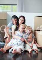 Famiy lying on floor after buying house