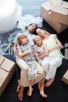 Beautiful family sleeping on the floor