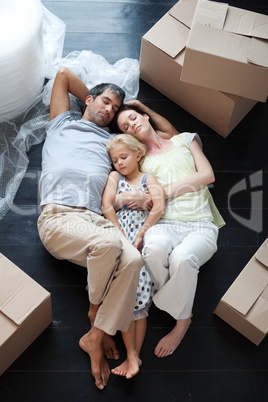 Famiy lying on floor after buying house