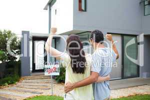 Happy couple after buying house