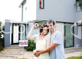 Happy couple after buying house