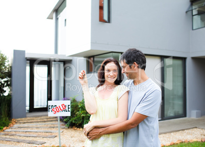 Happy couple after buying house