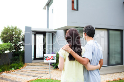 Newlyweds with their new house