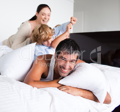 Family playing with pillows