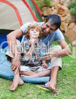 Father and son blowing bubbles